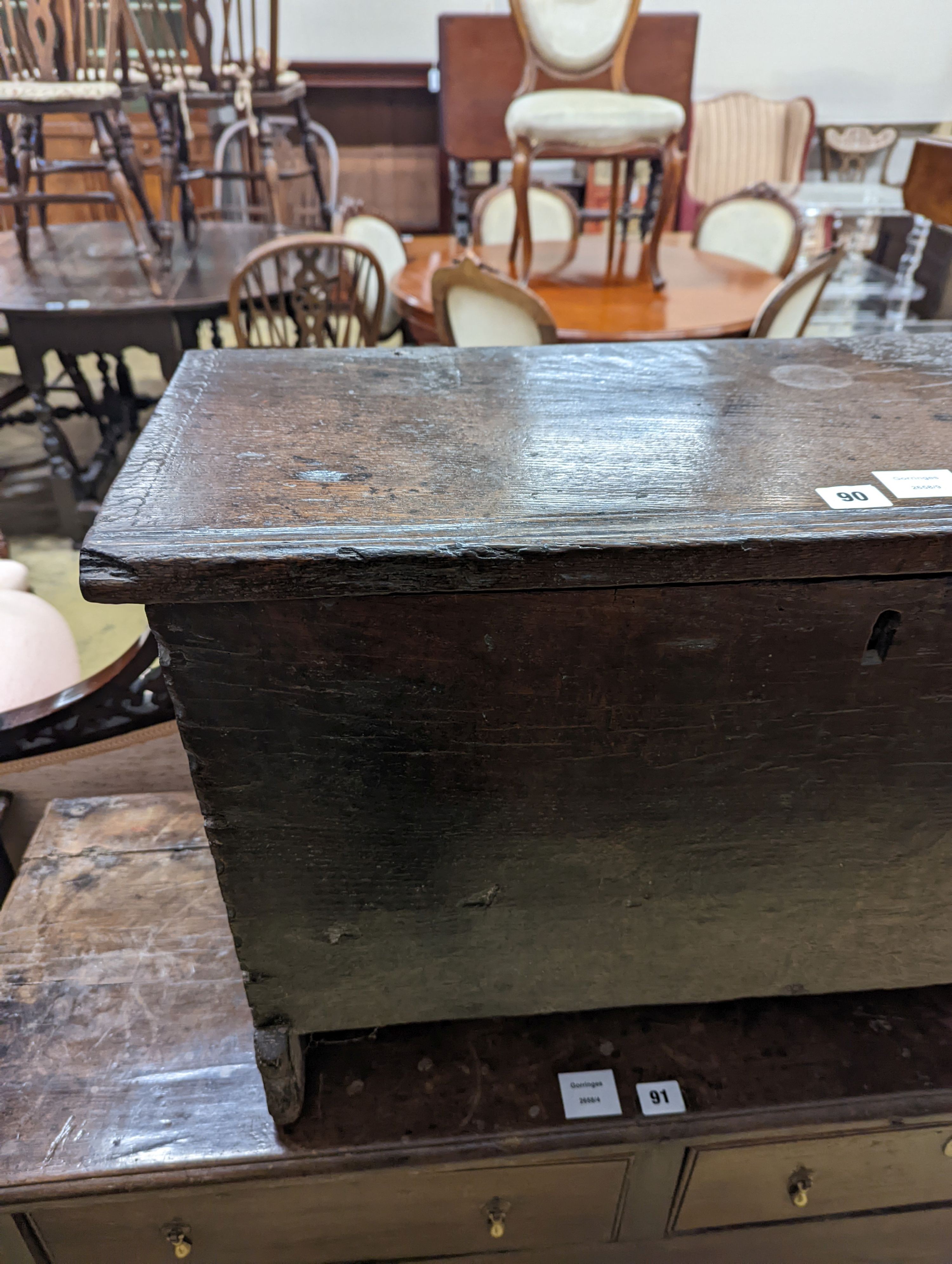 A small 17th century oak six plank coffer, length 77cm, depth 33cm, height 45cm
